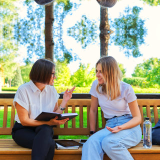 women having a conversation outdoors