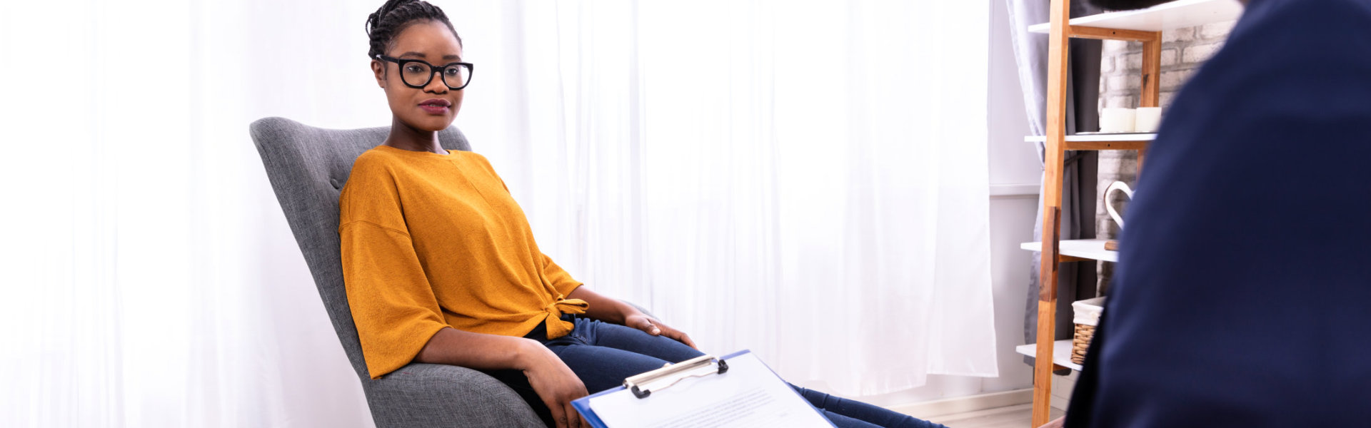 Woman Sitting Near Psychologist